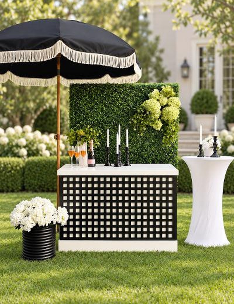 Black lattice cart styled with a scalloped umbrella